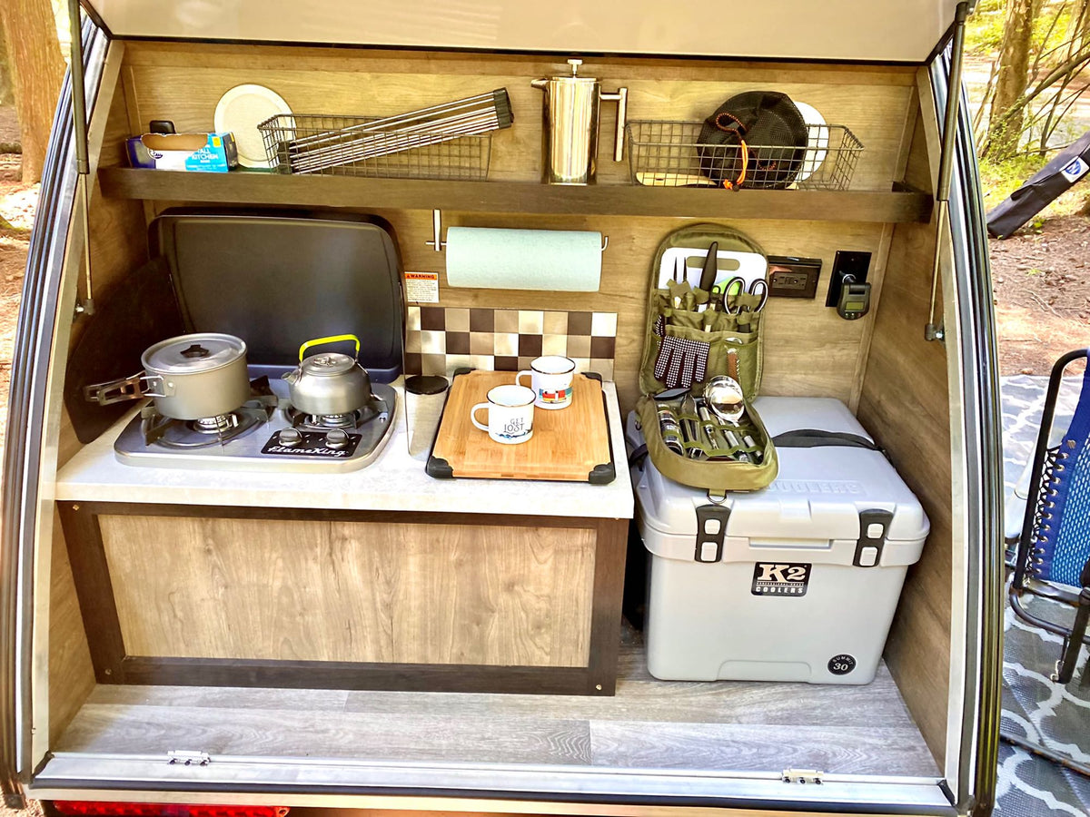 RV rental outdoor kitchen with stovetop, cooler & organized storage, perfect for camping. — photo 4