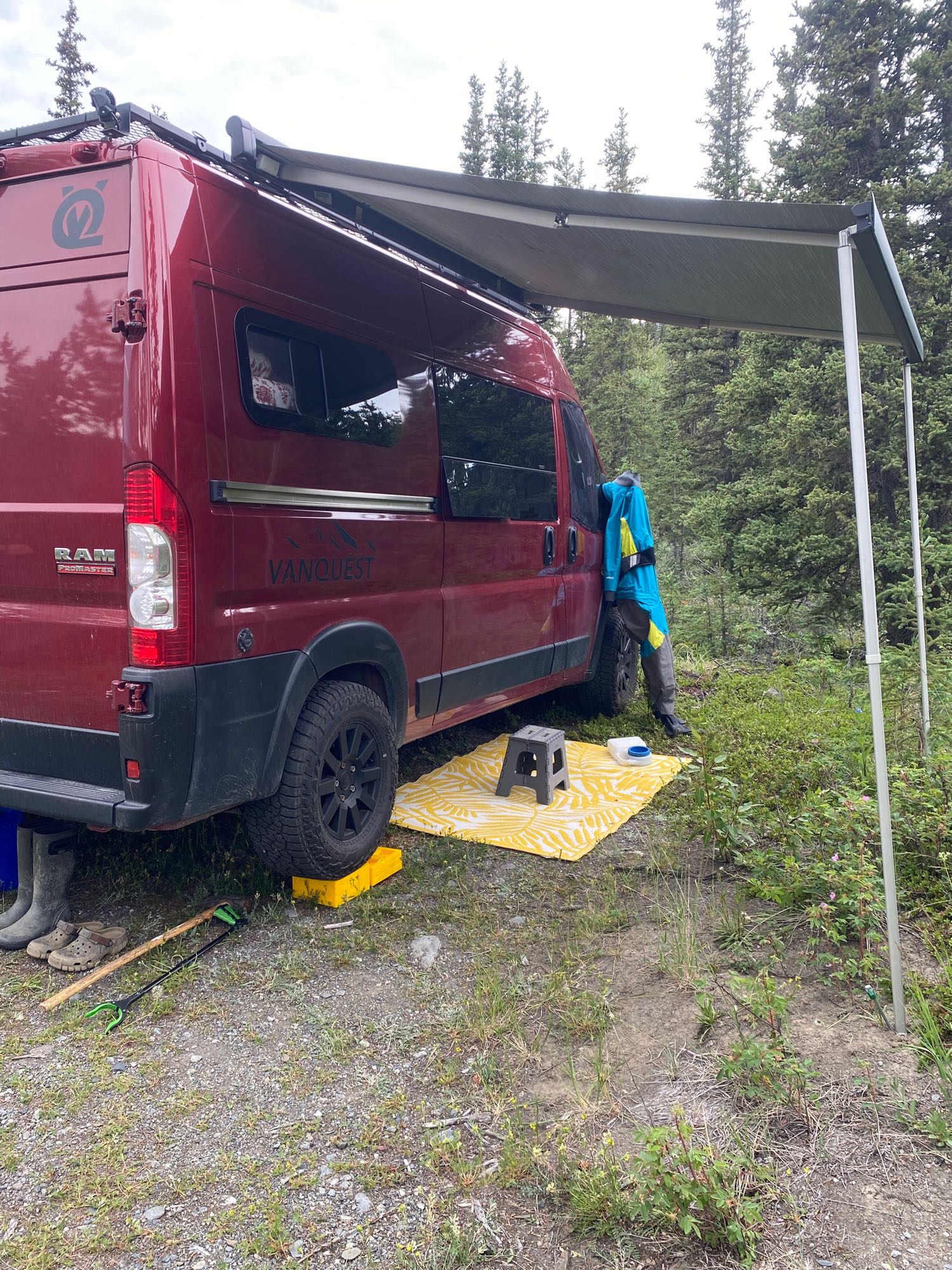 perfect for adventure.|Loading adventure gear into an RV rental. Two people prep for winter outdoor activities with bikes in a custom van.|This functional rv rental interior features a VANQUEST kitchenette with sink
