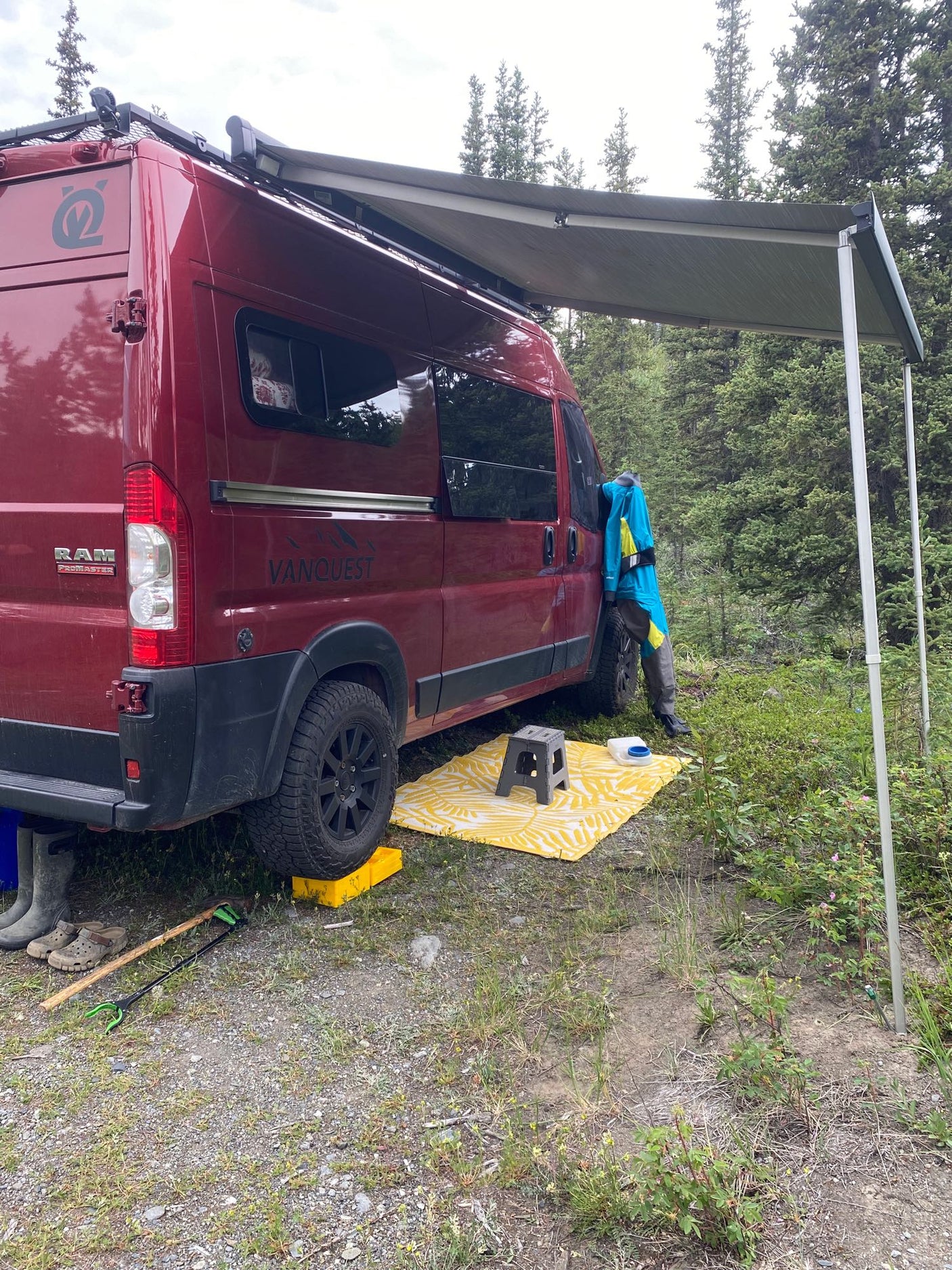 perfect for adventure.|Loading adventure gear into an RV rental. Two people prep for winter outdoor activities with bikes in a custom van.|This functional rv rental interior features a VANQUEST kitchenette with sink
