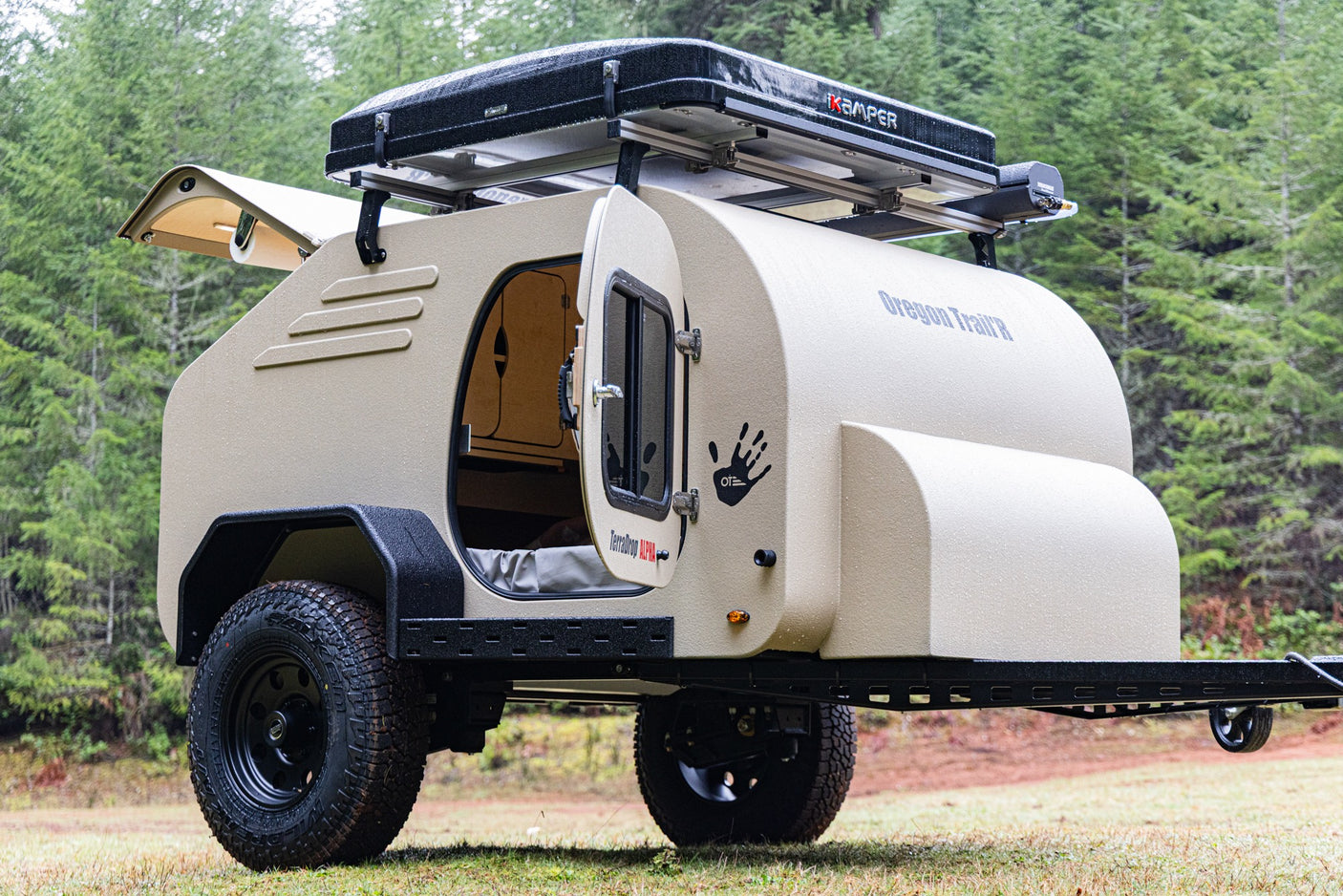 Explore with this rugged Oregon Trail'R teardrop camper rv rental, complete with a rooftop tent for off-road adventures.