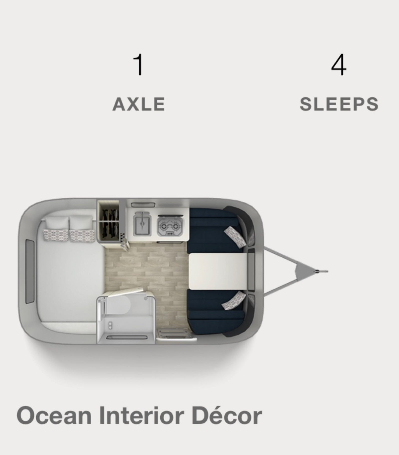 and a marker in a wooden insert.|RV rental: View of a compact bedroom featuring a dark blue bed