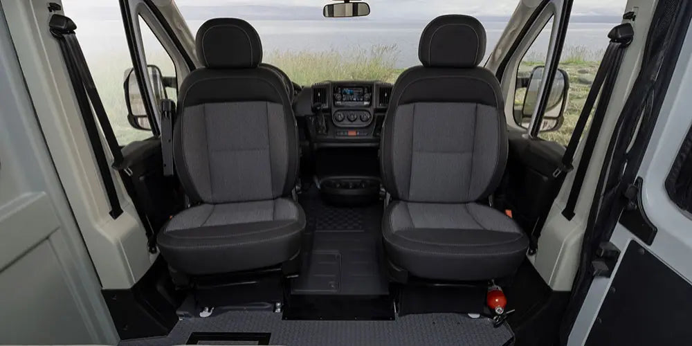 plus a serene view of nature including a distant horse.||RV rental interior shows a compact wet bath with toilet