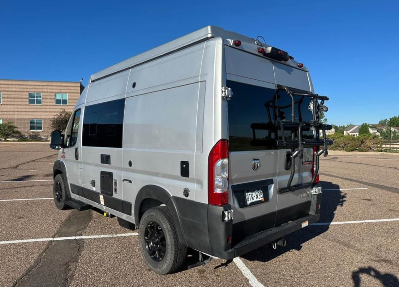 & swivel front seats. Ready for your road trip!|RV rental interior: cozy couch/bed