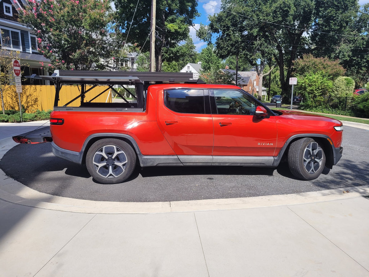 perfect for an rv rental adventure.|Red Rivian R1T electric truck with GFC camper shell — photo 14