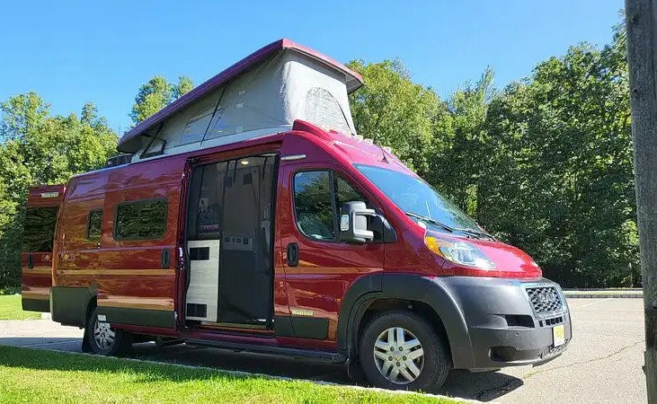 Red pop-top camper van rv rental with doors open