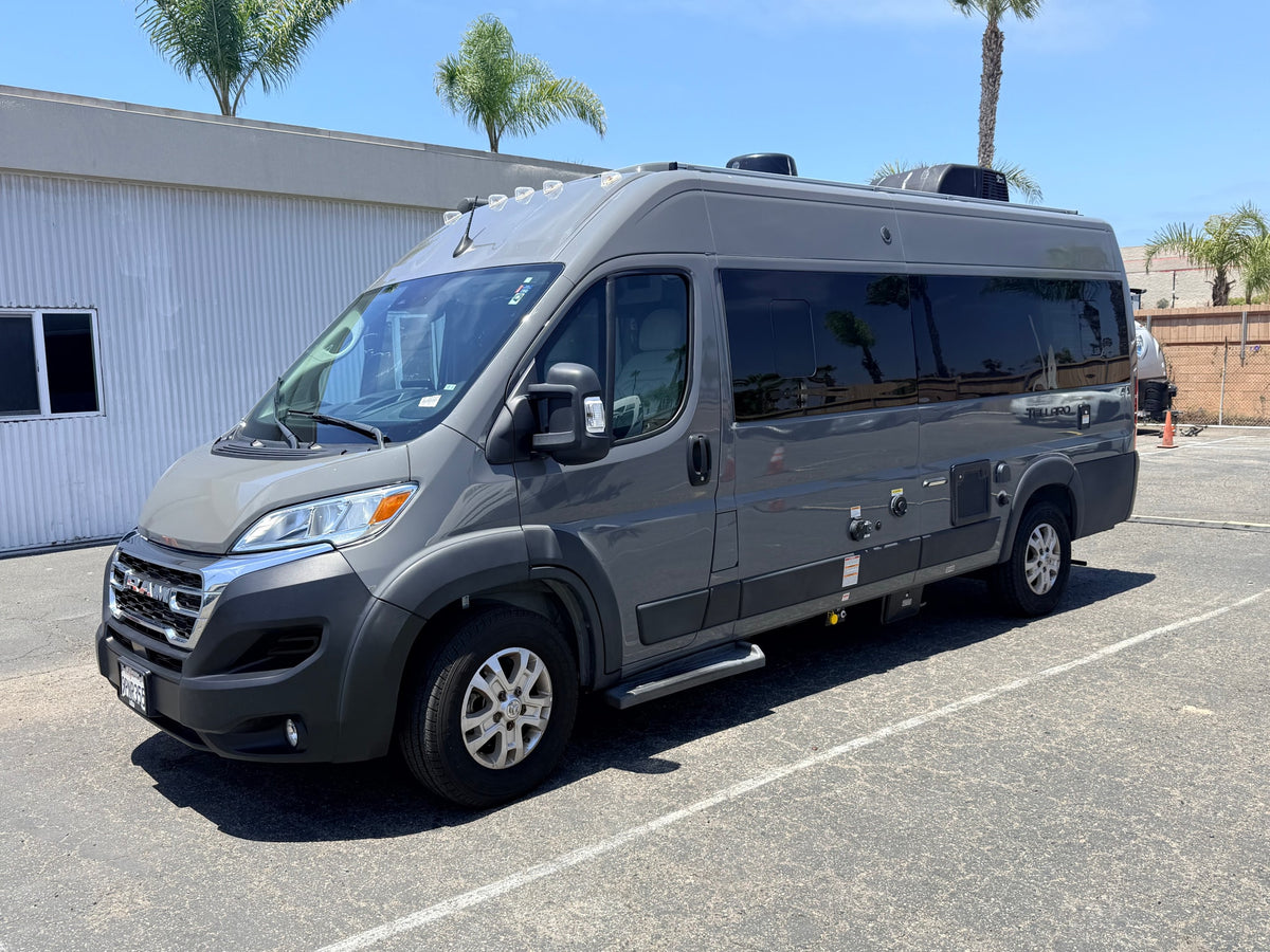 shown from the rear-side. Ready for travel adventures in this camper van.|This grey Ram Tellaro Class B camper van — photo 2