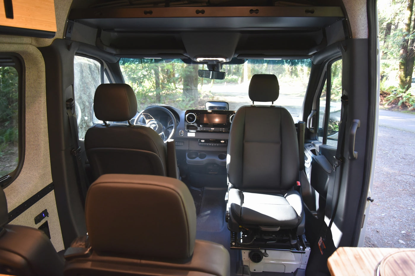 View inside an rv rental camper van from the rear, showing the cockpit with front seats and dashboard, ready for adventure. — photo 9