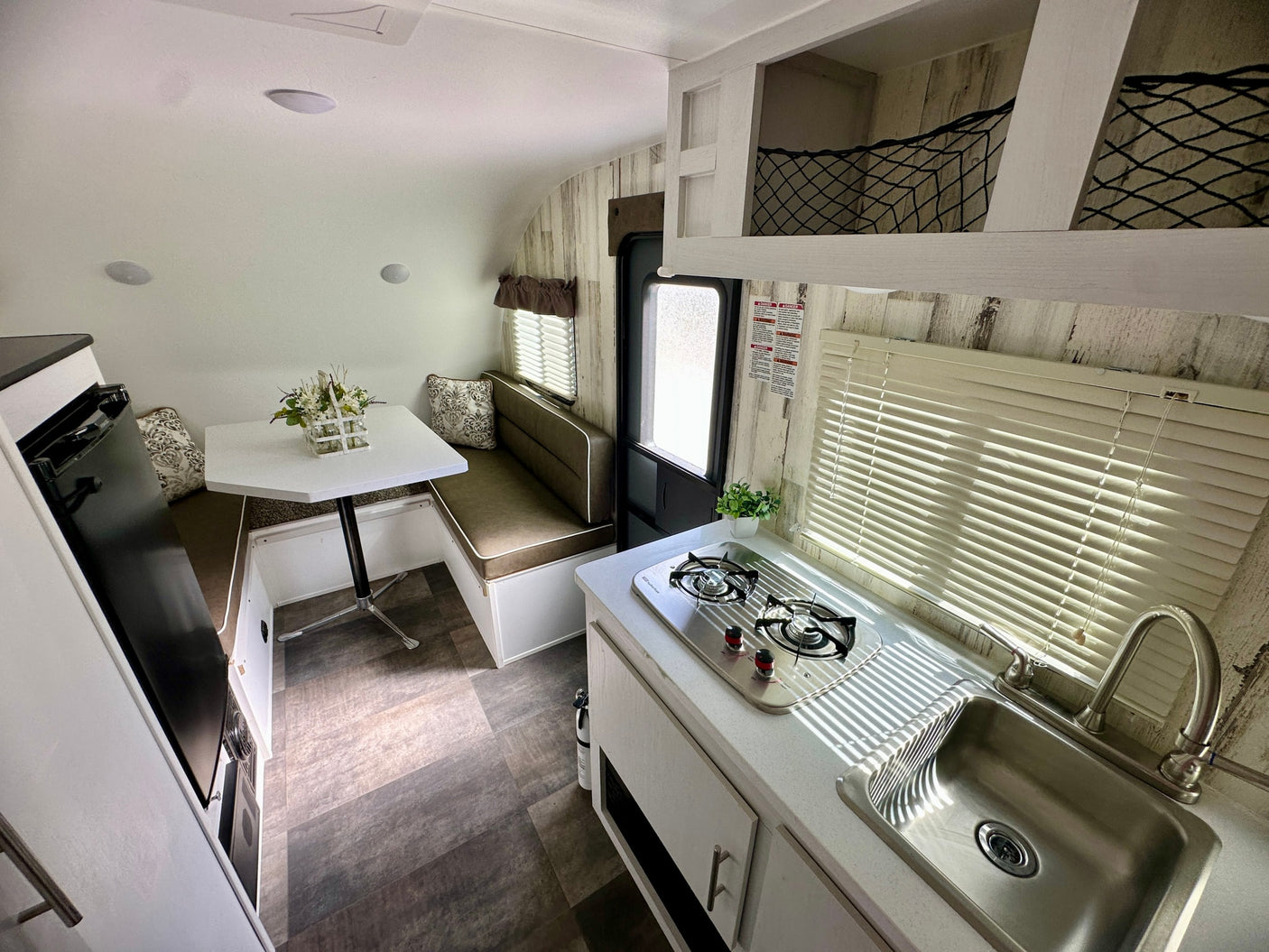 modern design. Ideal for travelers.|RV rental: Compact interior showing bunk bed