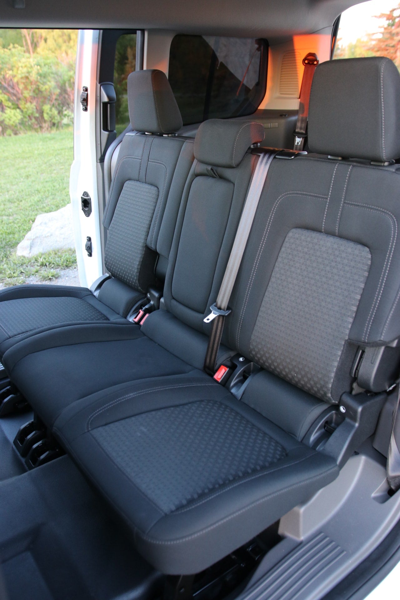 This spacious RV rental features configurable dark gray rear seats, providing ample room for passengers and gear.