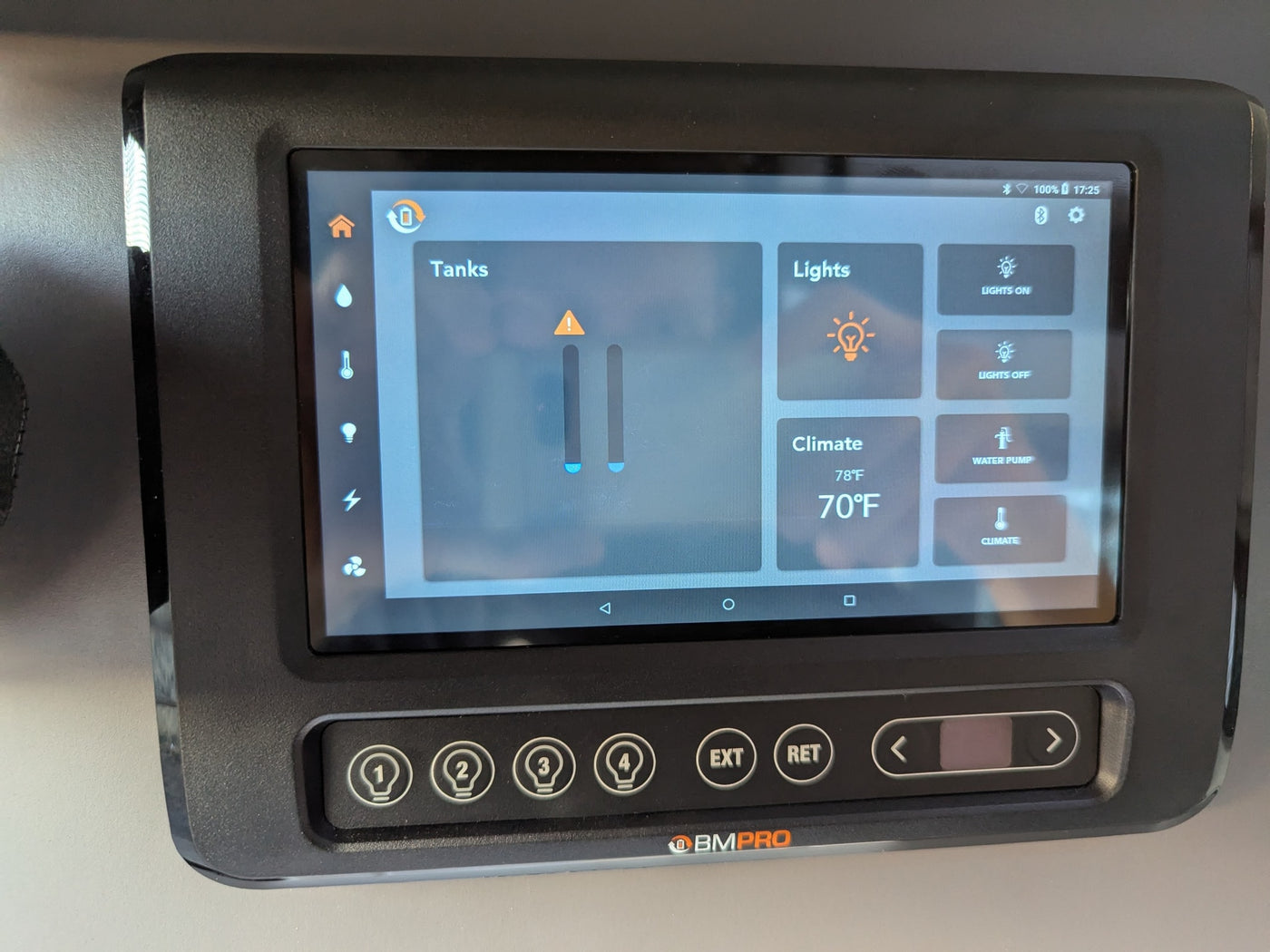 This RV rental's BMPRO digital control panel shows controls for tanks, lights, and climate set to 70°F. — photo 14