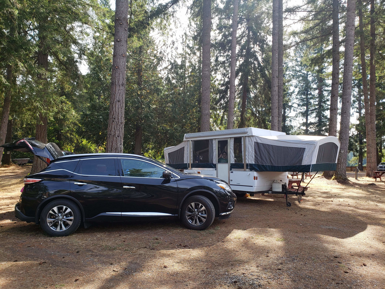 and wood cabinets. Ready for your next camping trip.|A white Coleman Sedona pop-up RV rental