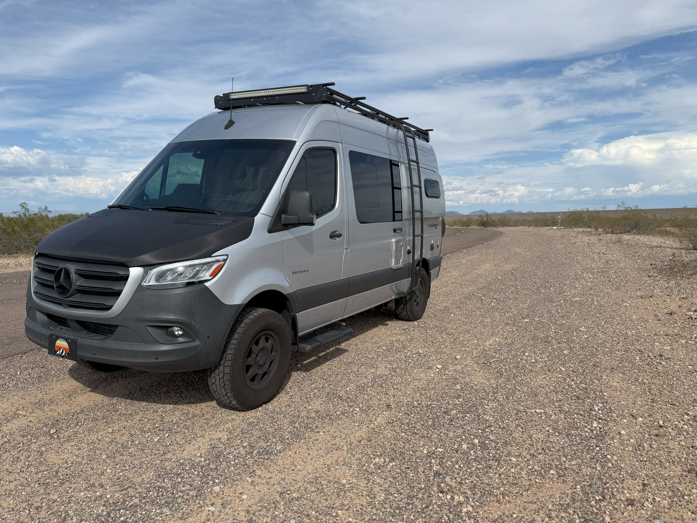 featuring an rv rental at a desert campsite.|Silver Mercedes Sprinter RV rental — photo 2