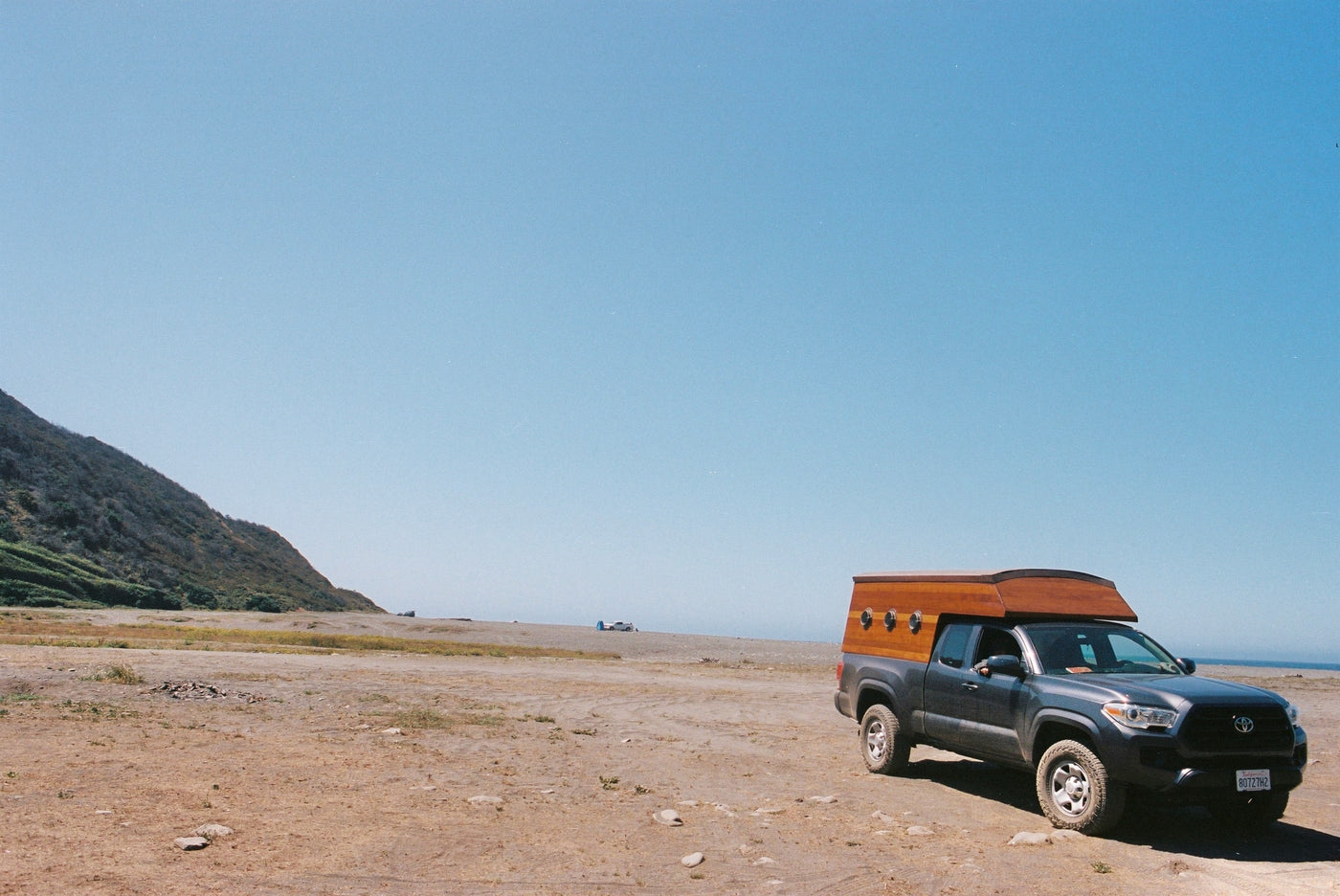 overlooking clouds.|Stunning coastal view from an RV rental's round window: blue ocean — photo 8