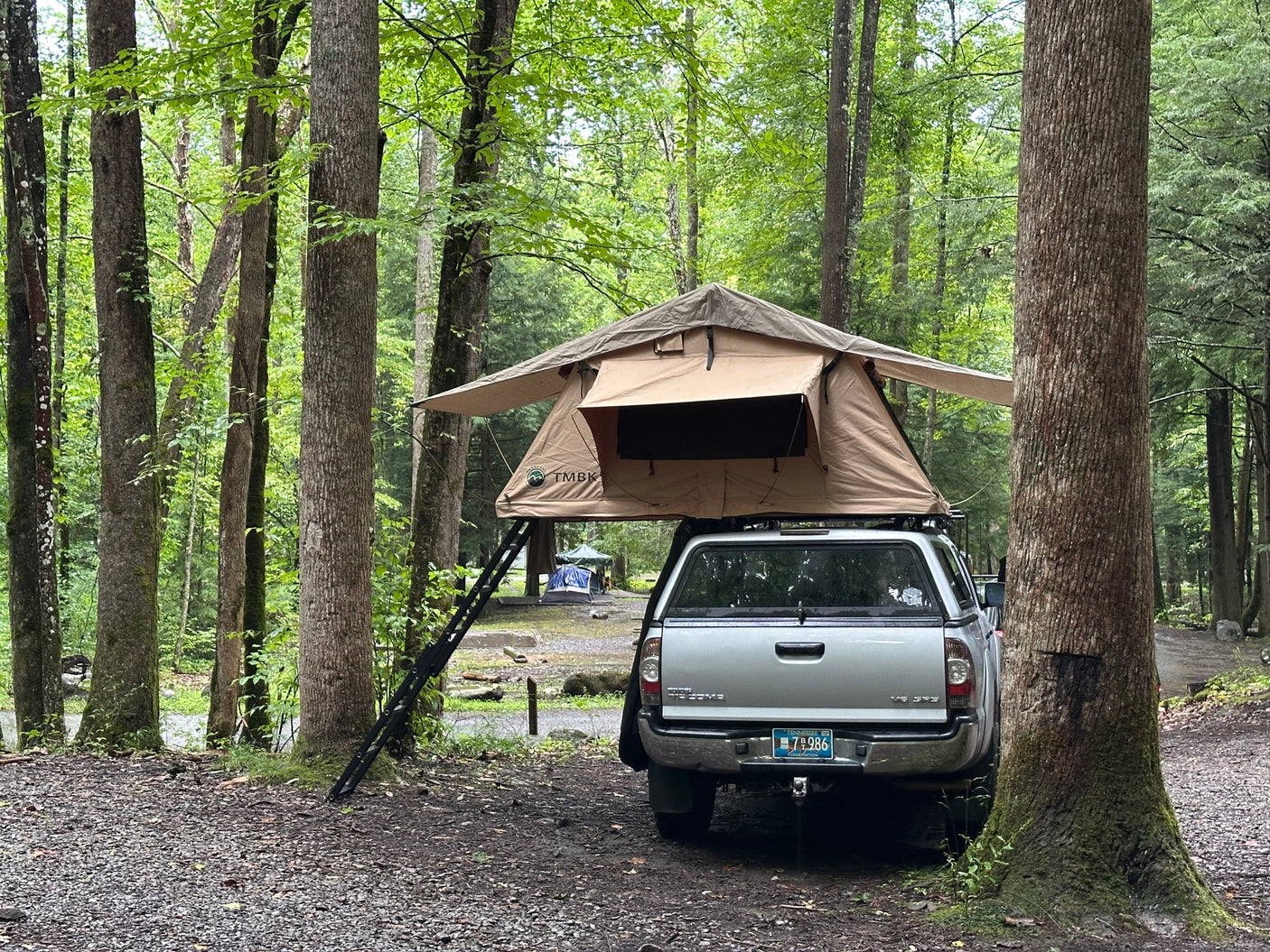 an alternative to traditional RV rental.|Overlanding adventure: Silver Tacoma truck with rooftop tent