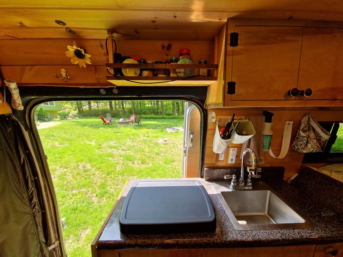 and compact wood stove.|An inviting RV rental interior with a cozy bed