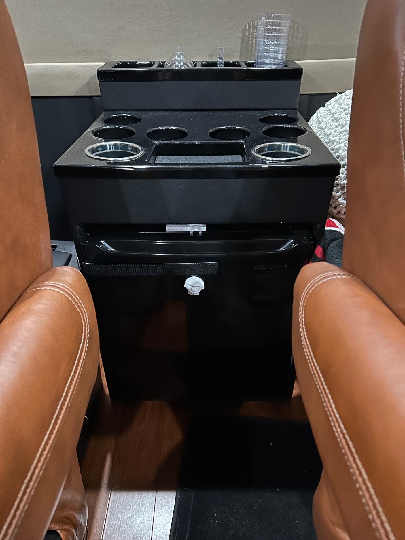 with bright lighting and secure tie-down points.|Rear interior of a custom rv rental van