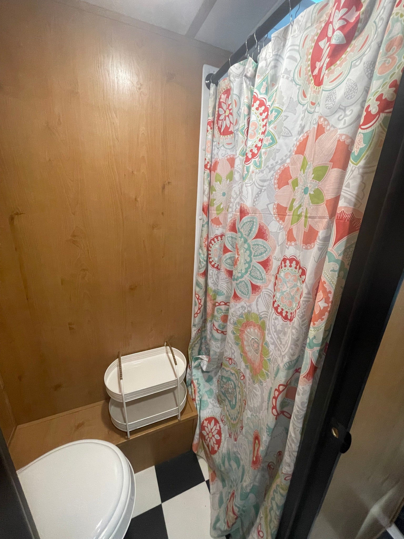 featuring a checkered floor and warm lighting.|A spacious