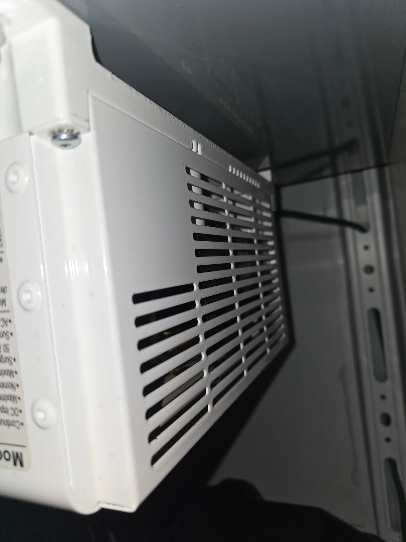 possibly for rv rental. Chrome shelving unit holds supplies; black textured floor.|Robust rv rental power system: dual Deka batteries — photo 13