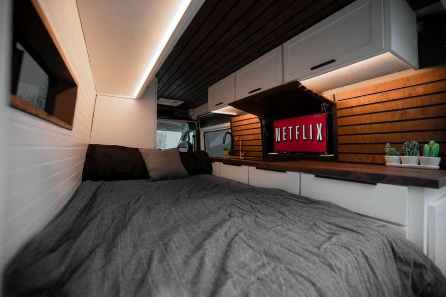 custom RV rental interior featuring a kitchen with wood counters