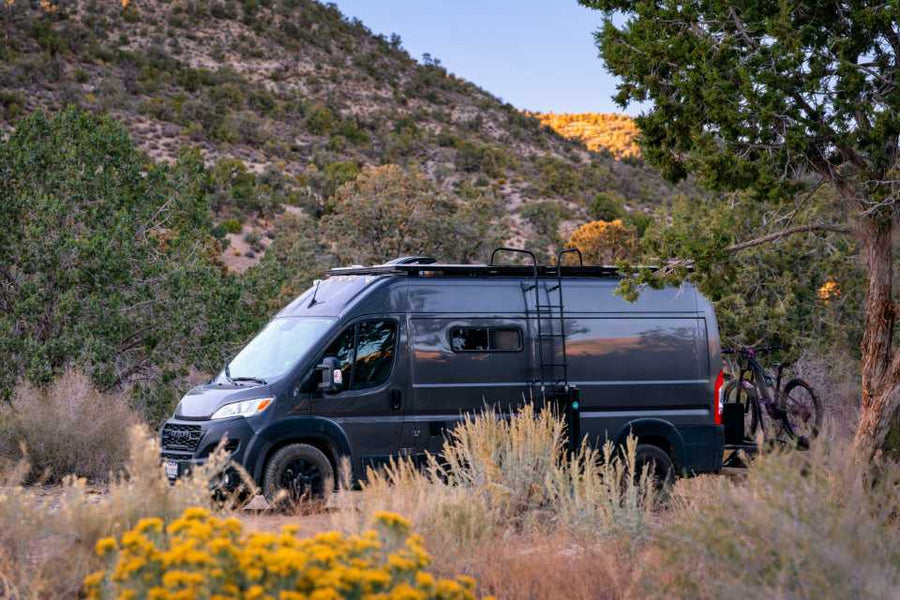 parked in a mountainous landscape. Ideal RV rental for outdoor adventure.|RV rental floor plan showing versatile day and night interior modes