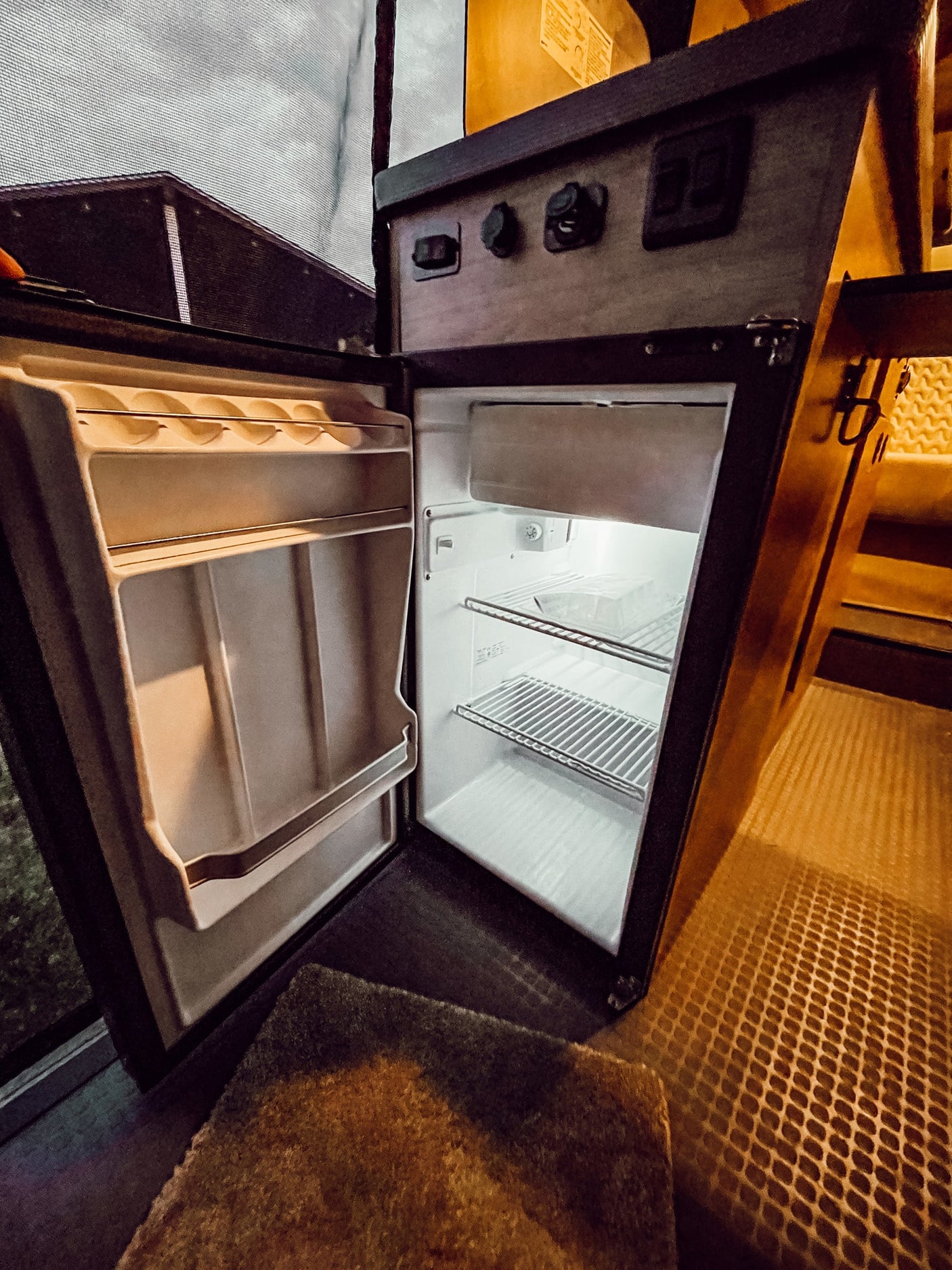offers a perfect adventure backdrop.|Well-lit RV rental interior at night. Features comfortable seating