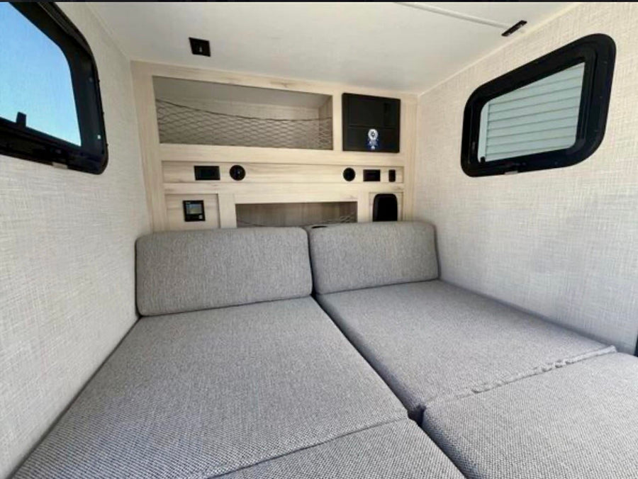 and safety fire extinguisher.|White and black Radical teardrop travel trailer