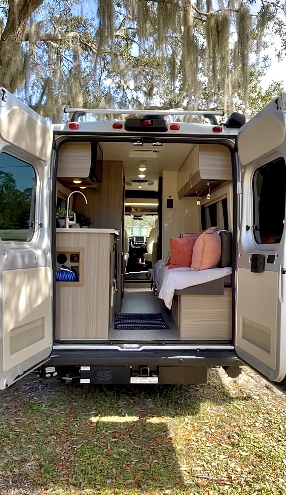 captured with an RV rental reflection. Adventure awaits!|An rv rental is parked on a winding road