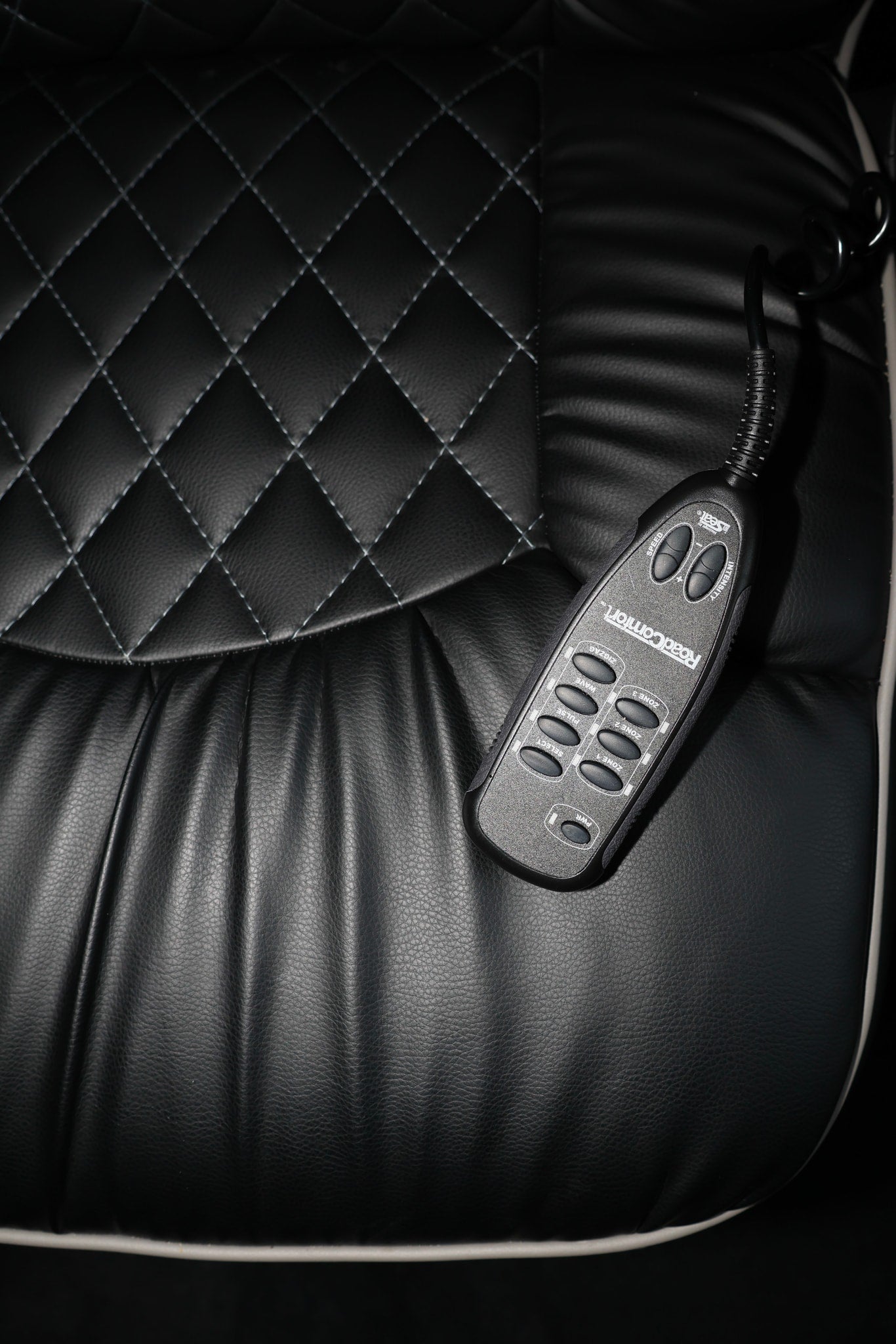 Luxury massage seat with "RoadComfort" remote control in an RV rental, providing enhanced travel comfort.