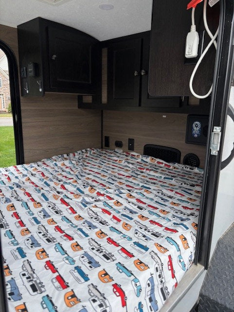 perfect for camping.|Compact RV rental with an open back hatch revealing an outdoor kitchen: stove