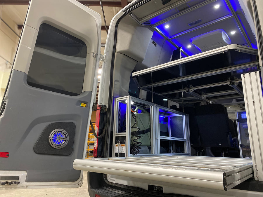 showcasing its interior. Great for an RV rental trip.|Inside an rv rental: a flexible multi-purpose platform above rear seats