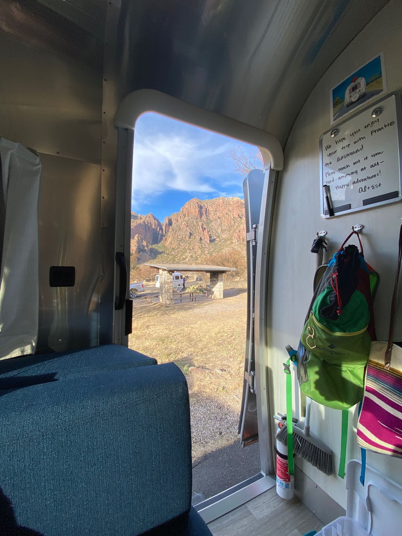 Solo Stove.|Step into luxury with this stunning Airstream RV rental! Experience comfort & style in this modern travel trailer interior.|Modern RV rental interior: aluminum walls