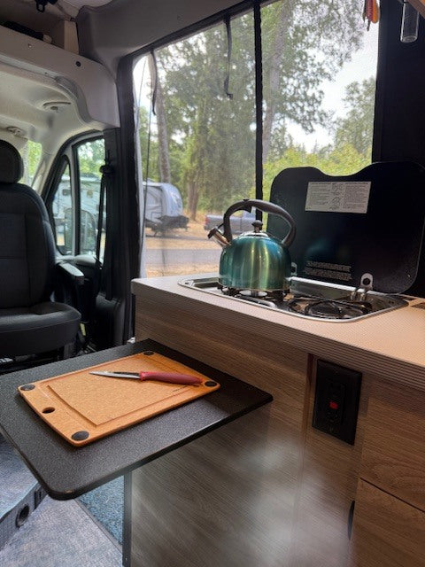 Prepping a meal using the pullout counter - not a cutting board but convenient workspace to use one.