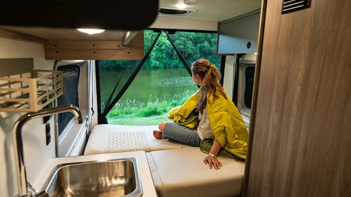 ready for adventure.|A sleek white Winnebago Solis camper van