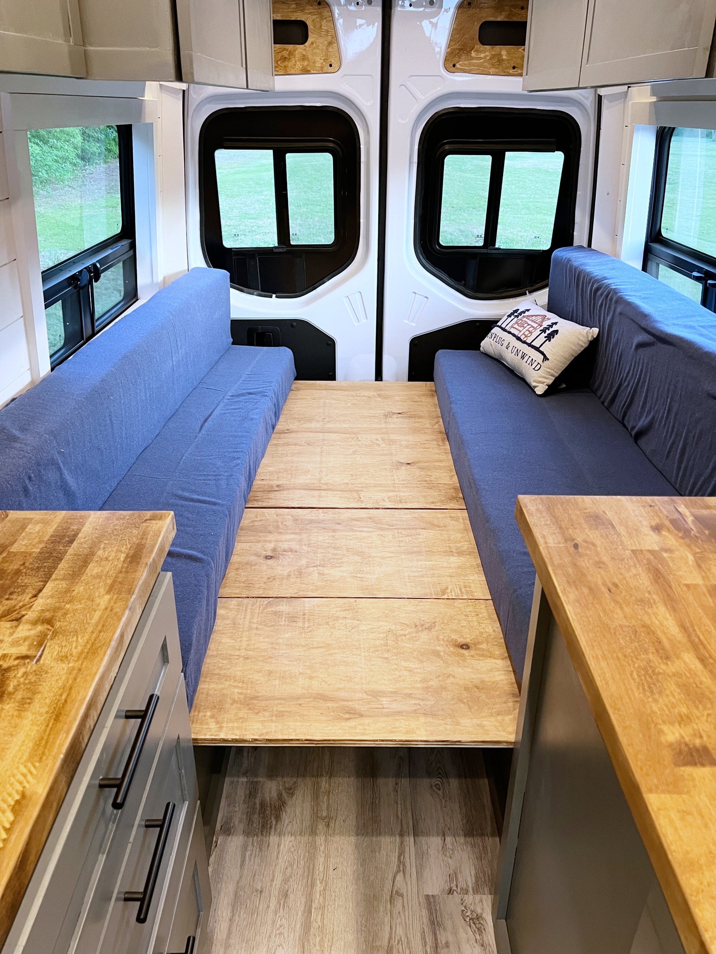 and cozy seating. Ideal for travel.|Modern RV rental kitchen: stainless sink