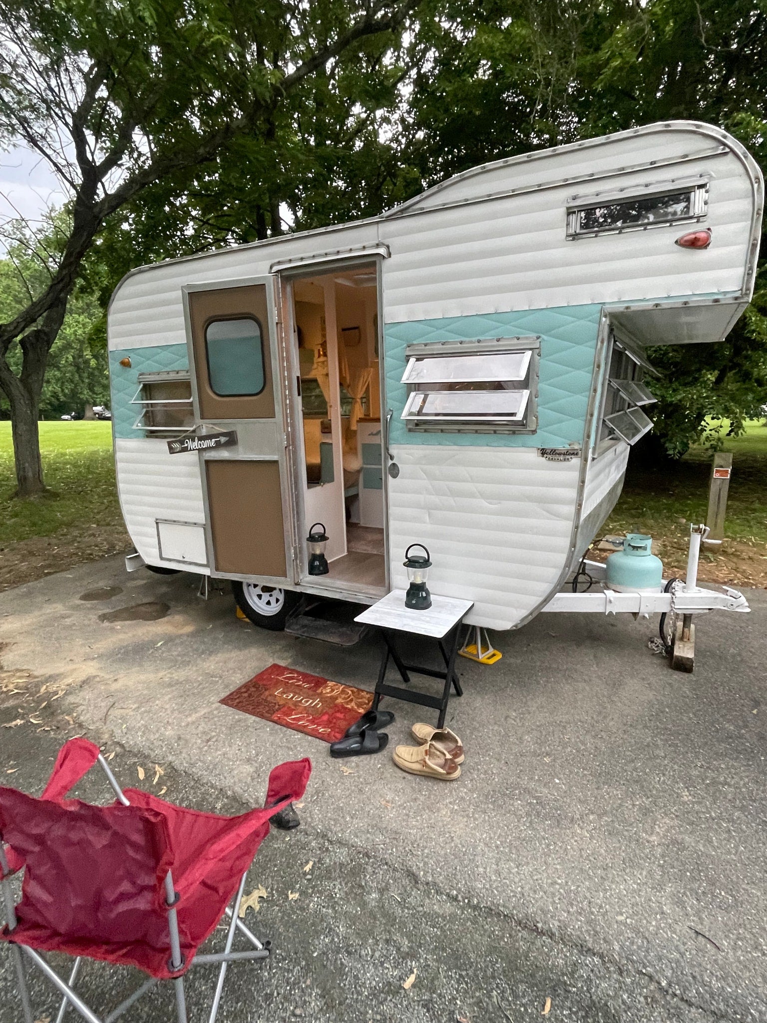 and grey blanket.|Experience comfort in this RV rental's cozy interior