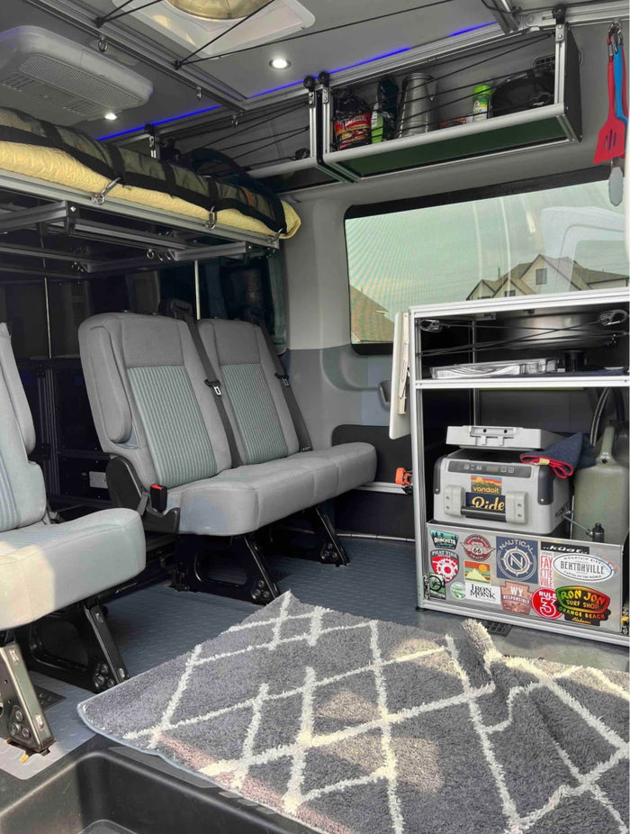 and colorful retro stripes.|RV rental: well-equipped van interior with seating