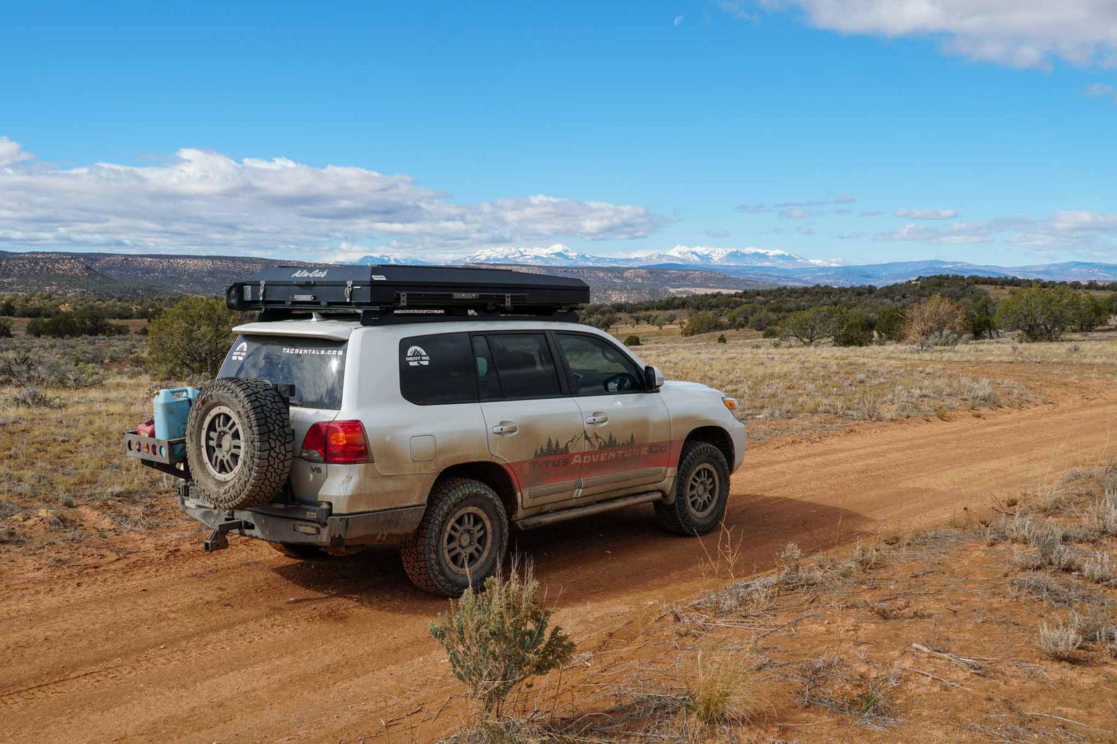 An off-road SUV with a rooftop tent