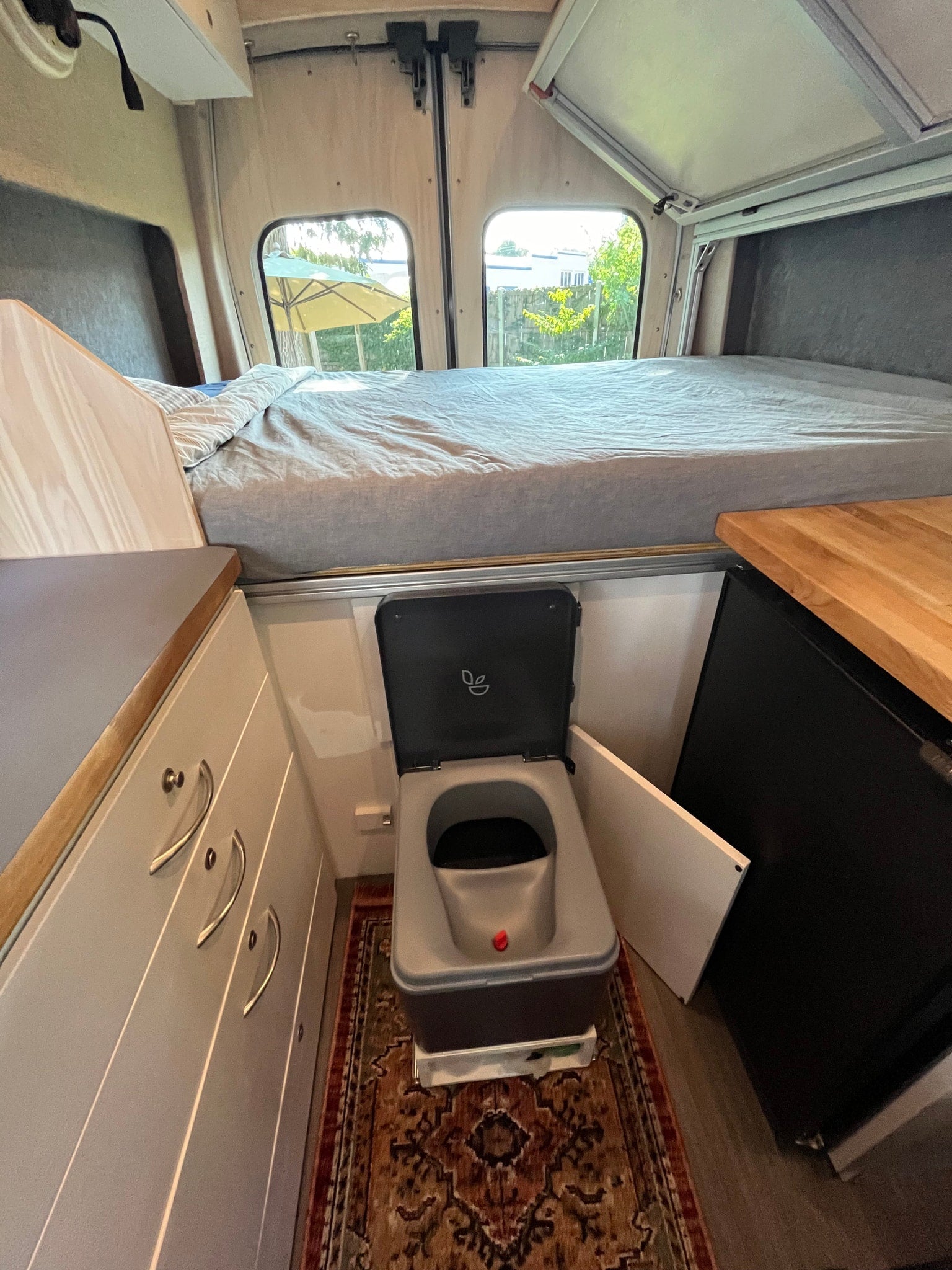and kitchen counter for comfortable travel.|Cozy RV rental interior: comfortable seating