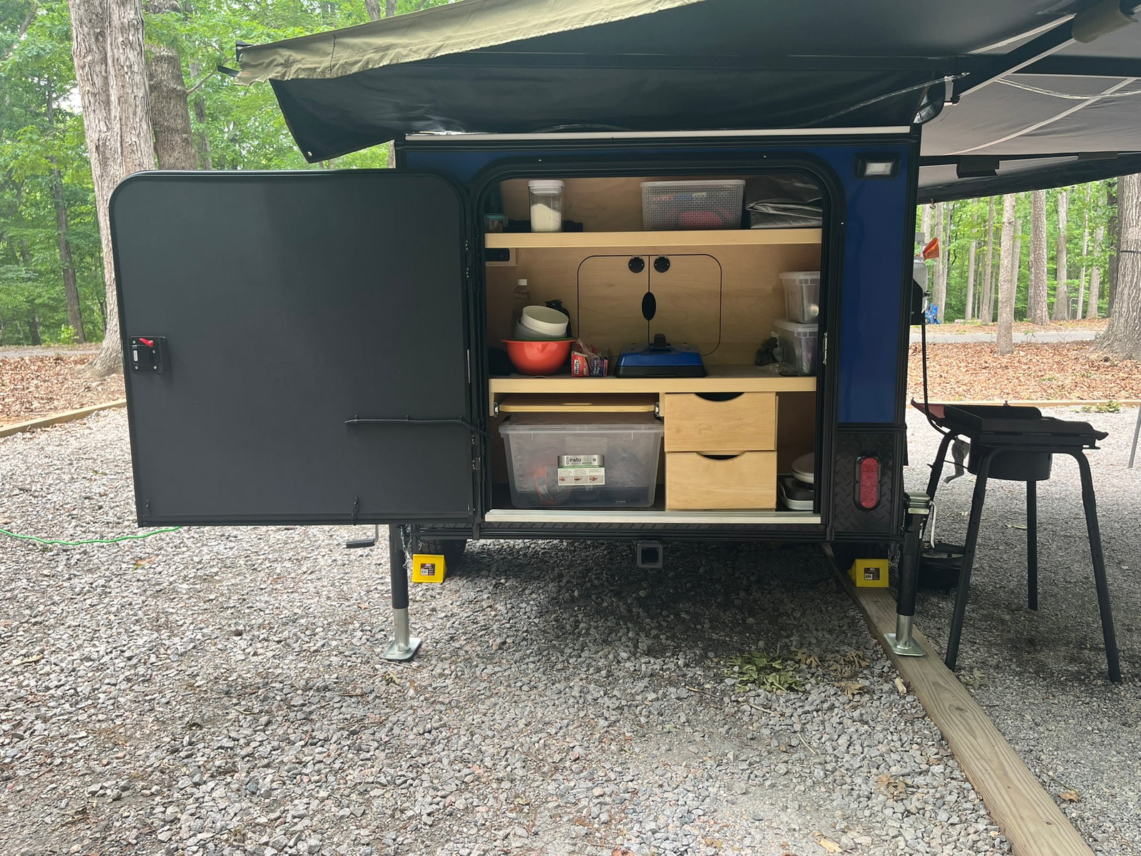 ready for an RV rental outdoor adventure.|This blue & black Hiker Trailer