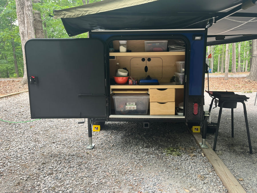 ready for an RV rental outdoor adventure.|This blue & black Hiker Trailer
