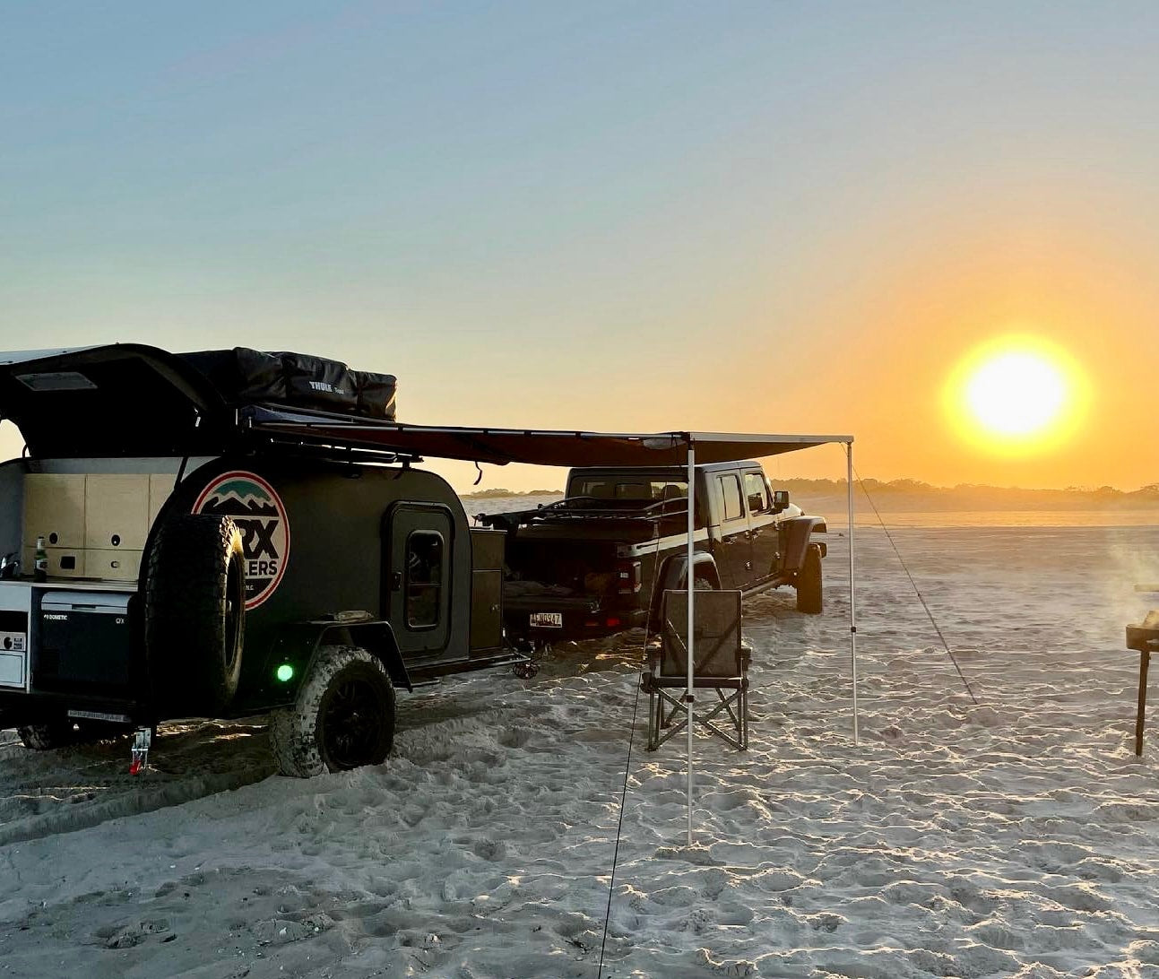 and overhead wooden cabinets.|A BRX camper trailer