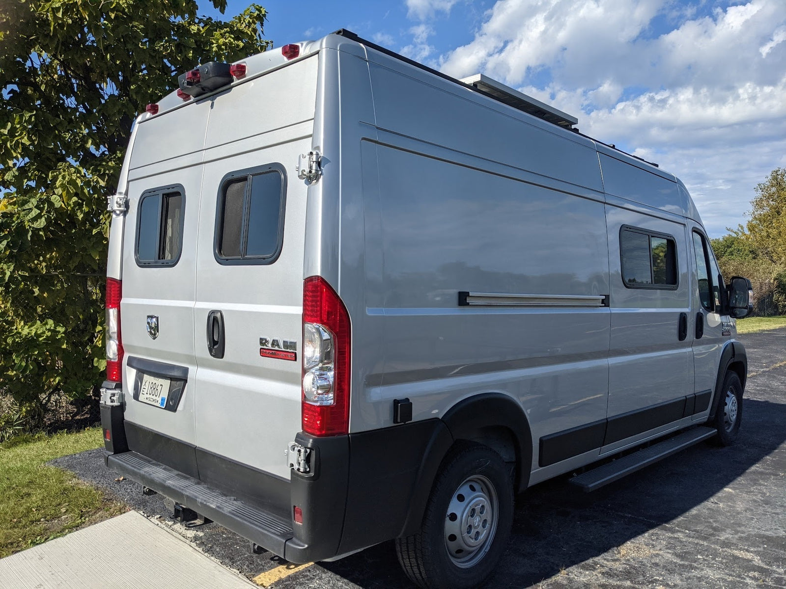 Silver Ram Promaster camper van, perfect for your next rv rental adventure. Equipped with solar & custom windows.