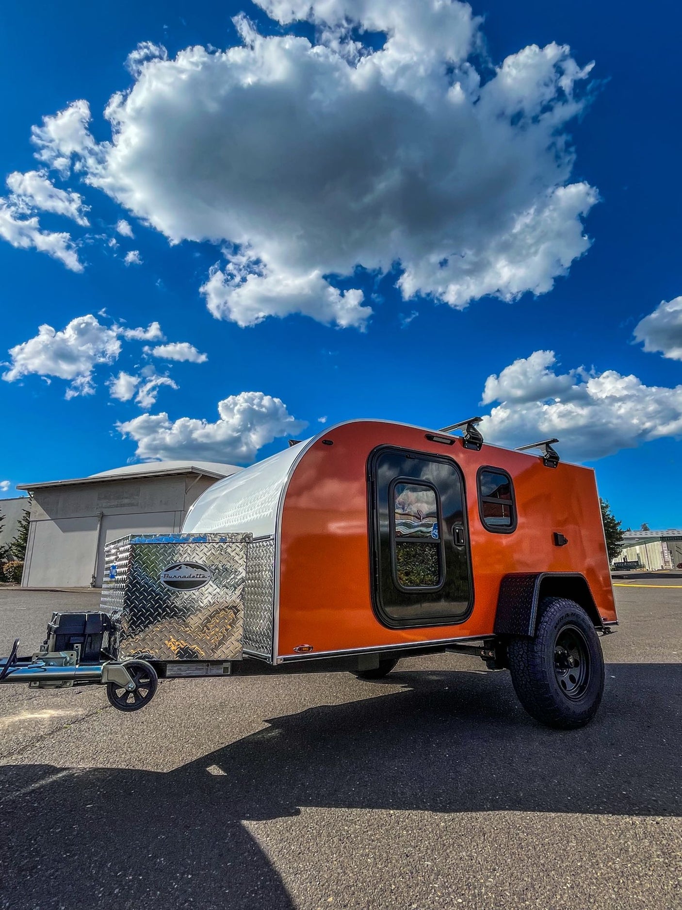 Vibrant orange & silver teardrop camper