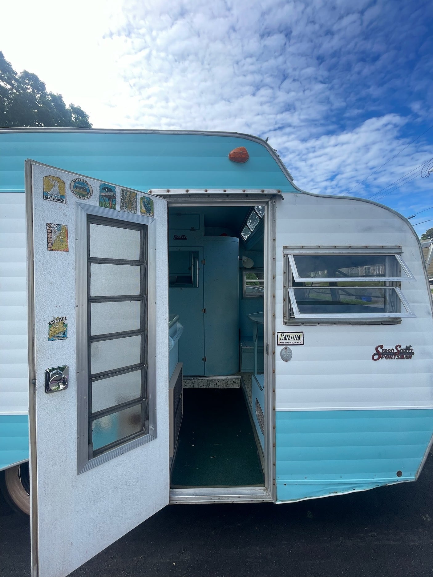 This charming turquoise & white vintage Serro Scotty camper