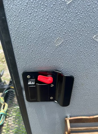 RV rental: Secure your travel with this interior RV door lock featuring a prominent red safety handle.