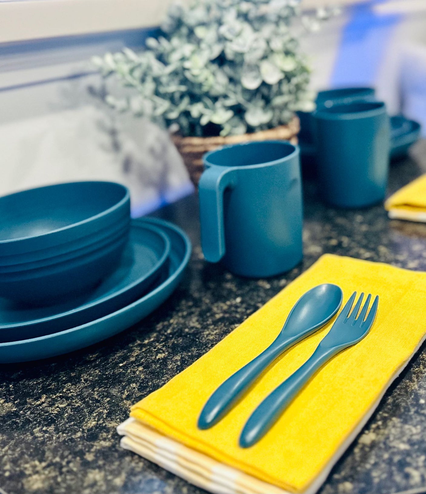 and ambient blue lighting.|Equipped RV rental kitchen with compact stovetop