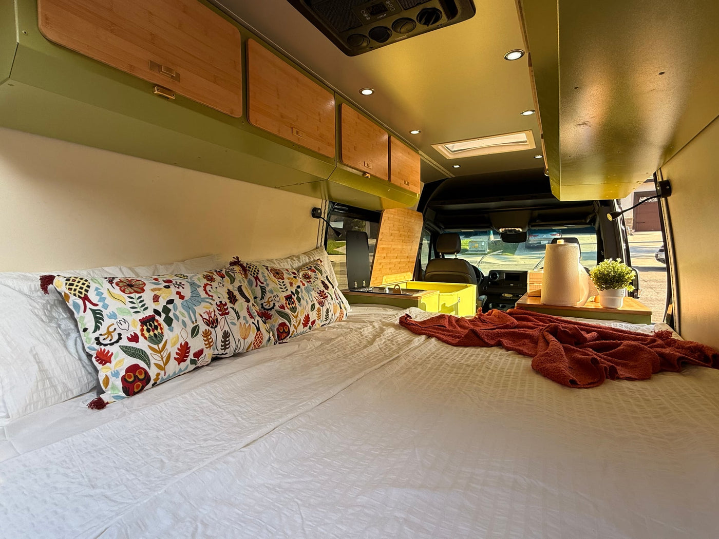 ready for adventure.|Inside a vibrant RV rental: custom green cabinetry — photo 12