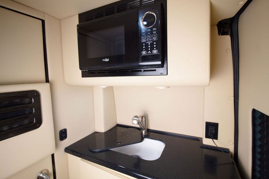 and the spacious front cabin with driver's area.|RV rental interior layout. Overhead plan details seating