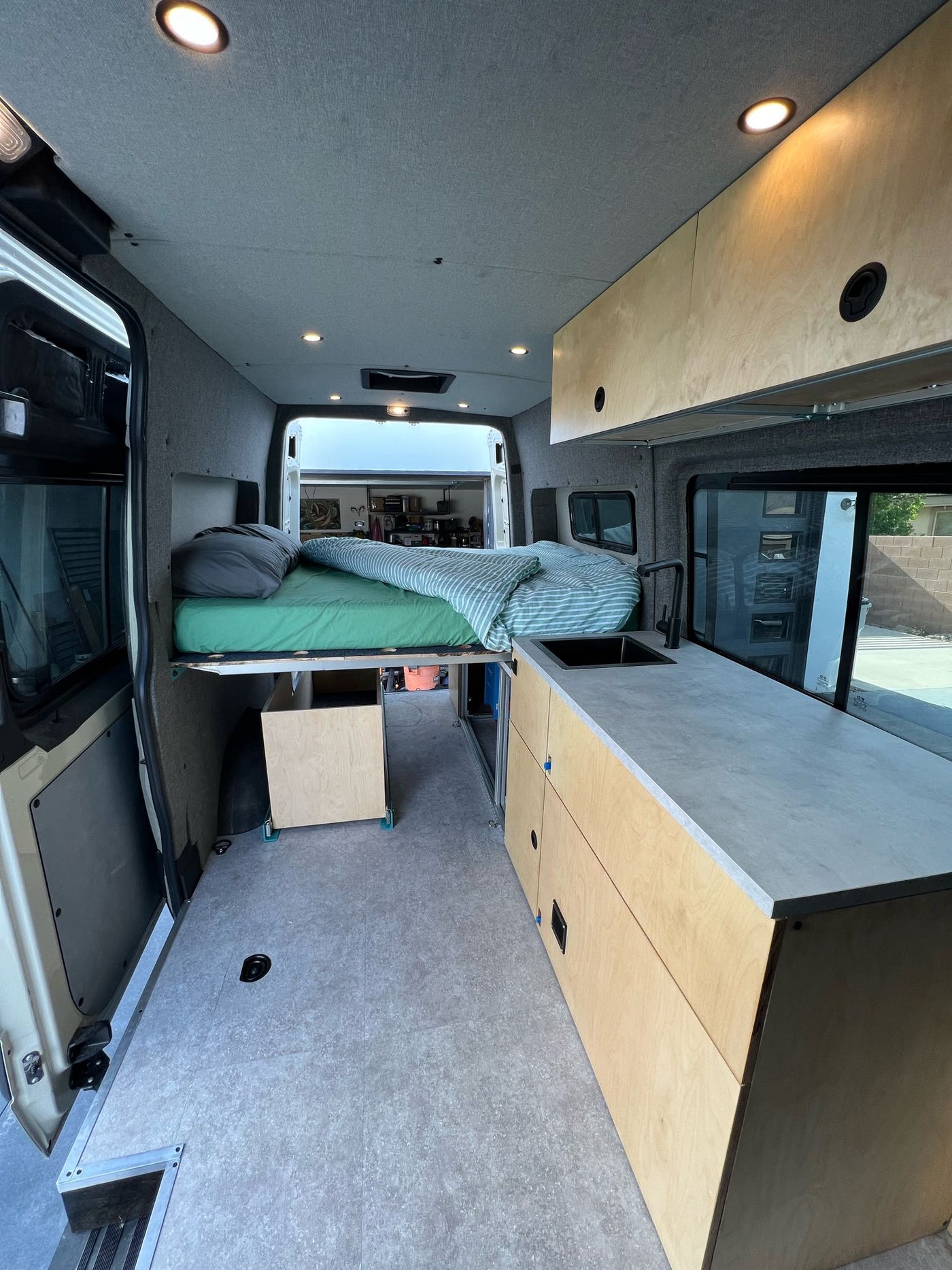 parked at a modern home.|Inside a modern Mercedes-Benz Sprinter van — photo 17