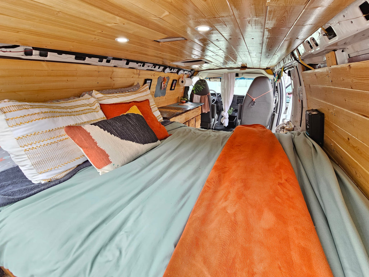 and smart storage solutions for adventurous road trips.|RV rental interior shows grey seats — photo 4
